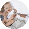 adult-taking-care-baby-weigh
